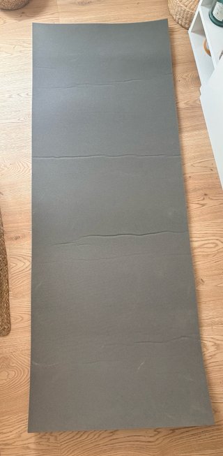 Esterilla azul para yoga o ejercicio