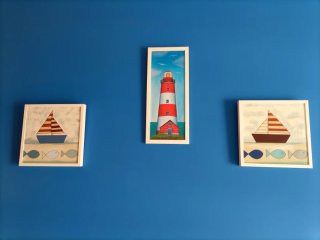 Cuadro decorativo náutico con barco y peces