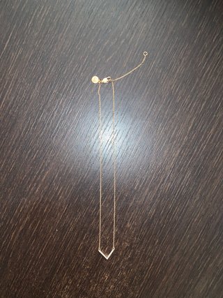 Collar MK con baño de oro rosa y pavé.