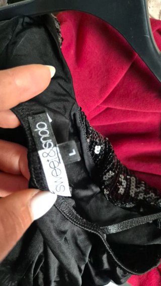 Top donna nero con paillettes e stampa floreale