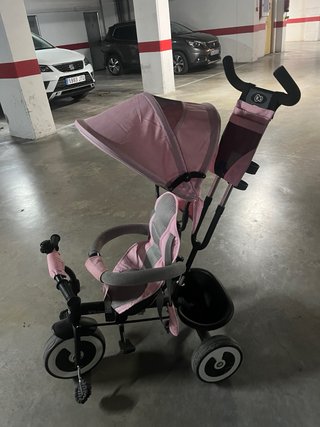 Triciclo infantil rosa evolutivo con capota