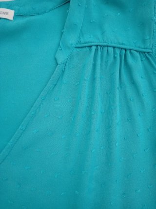 Blusa turquesa con manga corta