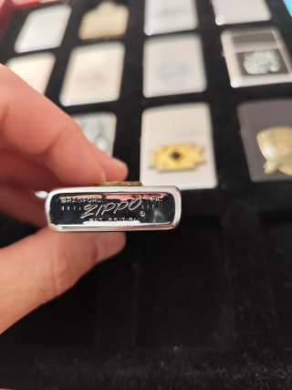 Zippo con insignia de tiro