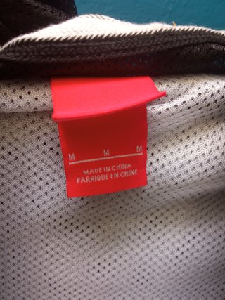 Chaqueta Lonsdale cortavientos negra y turquesa