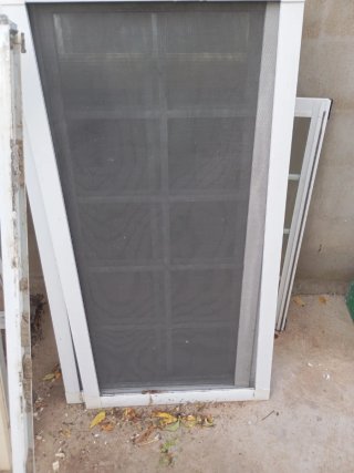 Ventana Climalit con persiana y palillería