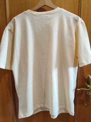Camiseta Zara amarilla con bolsillos