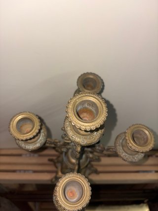 Antico candeliere in bronzo