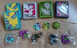 Set sleeves carte Pokémon + dadi e monete