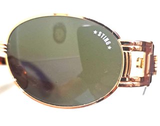 Gafas de sol Sting doradas y negras