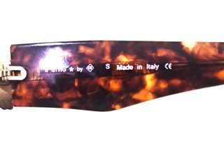 Gafas de sol Sting doradas y negras