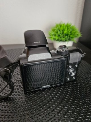 Samsung WB100 + Estuche de transporte | Zoom 26x |