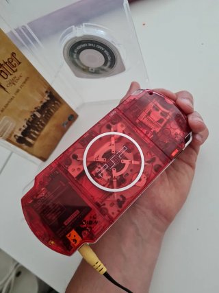 PSP 3000 Roja Transparente + Juego Harry Potter