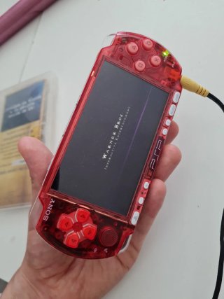 PSP 3000 Roja Transparente + Juego Harry Potter