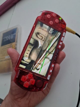 PSP 3000 Roja Transparente + Juego Harry Potter
