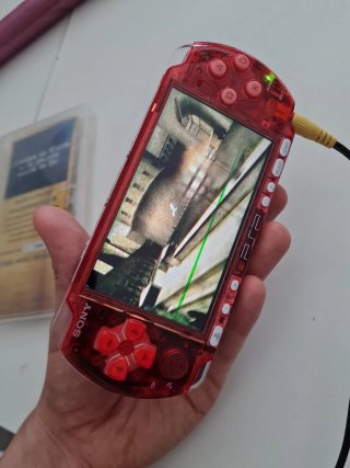 PSP 3000 Roja Transparente + Juego Harry Potter