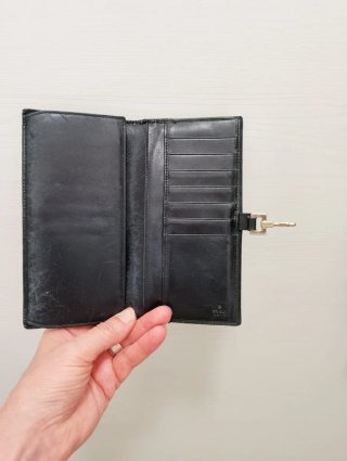 Portafoglio Gucci nero con fibbia oro
