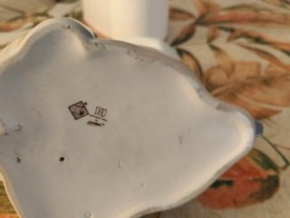 Figura de porcelana niña sentada