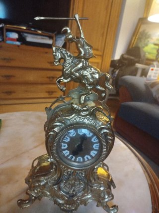 Reloj de sobremesa de bronce con figura ecuestre