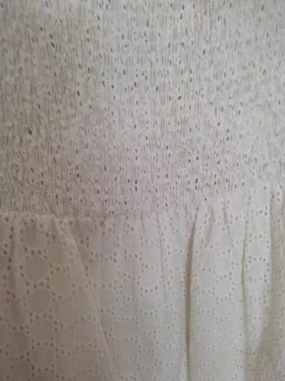 Mono bordado blanco con bolsillos