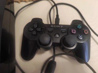 Consola PlayStation 3 Negra con 19 juegos.