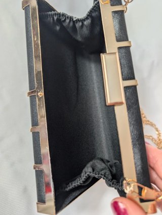 Bolso de fiesta rígido negro y dorado