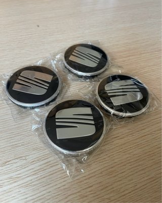 4 Tapabujes Seat 56mm Negro/Plata Originales Nuevo