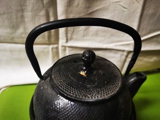 Tetera de hierro fundido con calentador