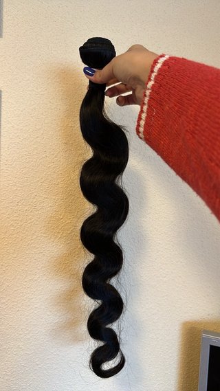 Pelo virgen ondulado negro