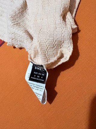 Top asimétrico crudo talla única