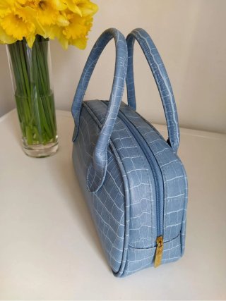 Bolso mini azul Estée Lauder