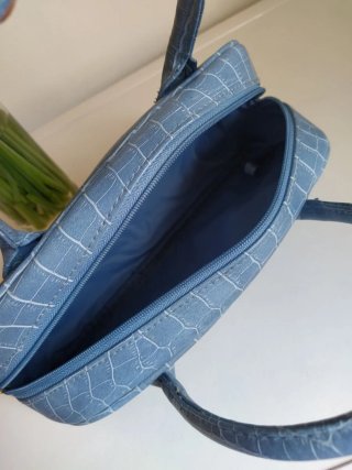 Bolso mini azul Estée Lauder
