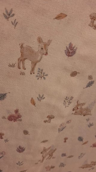 Protector de cuna con estampado infantil