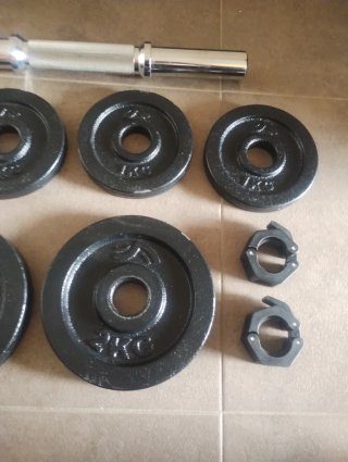 Pesi e barra per palestra