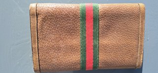 Portafoglio Gucci in pelle marrone con banda