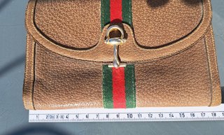 Portafoglio Gucci in pelle marrone con banda