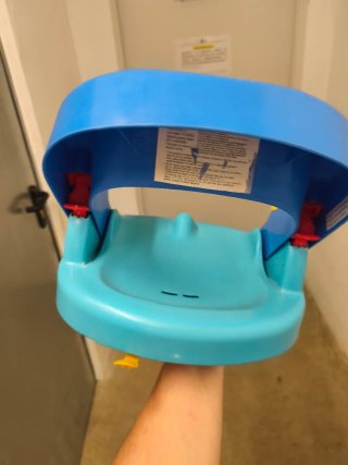 Asiento bebé azul y amarillo