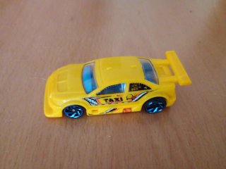 Coche de juguete taxi amarillo Hot Wheels