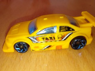 Coche de juguete taxi amarillo Hot Wheels