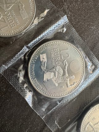 Monedas de plata 2000 pesetas y 12€