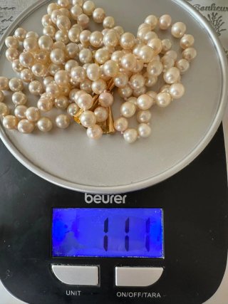 Collana di perle con chiusura a fiocco oro