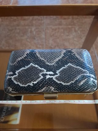 Bolso clutch estampado piel serpiente