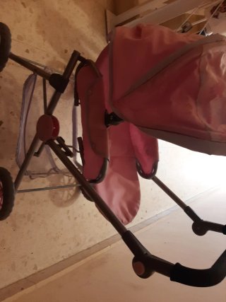 Carrito de muñecas rosa