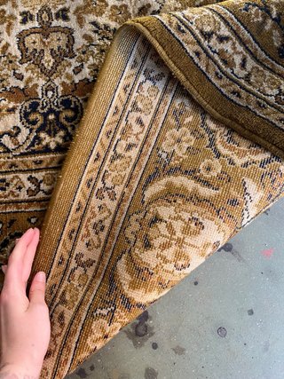 Alfombra persa beige y marrón
