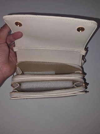 Bolso YSL blanco con logo dorado