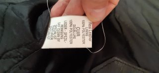 Chaqueta de piel cruzada negra