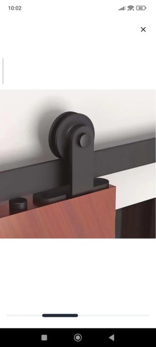 Puerta corredera negra con guía granero