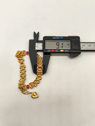 Pulsera Oro 18kt piedras rojas y colgante corazón