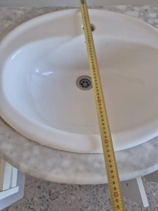 Mueble de baño con lavabo de mármol