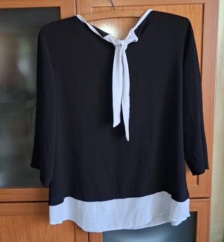 42/44, Precchio, blusa negra y blanca