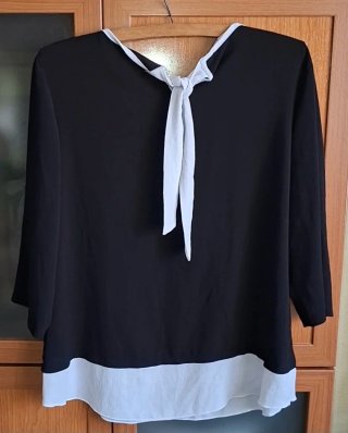 42/44, Precchio, blusa negra y blanca
